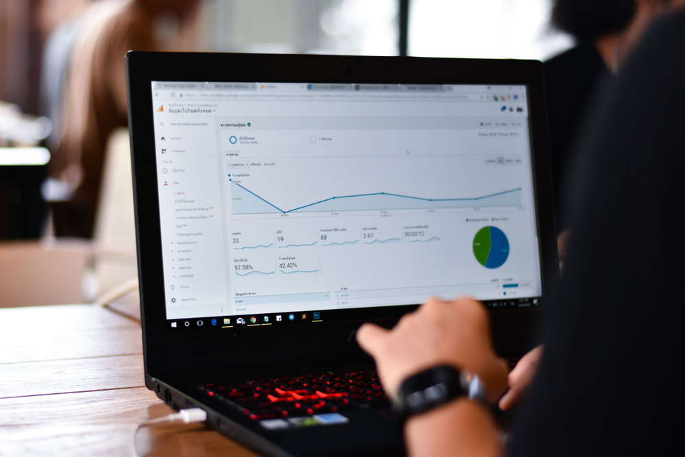 worker on laptop checking traffic visitor on website by google analytics report.