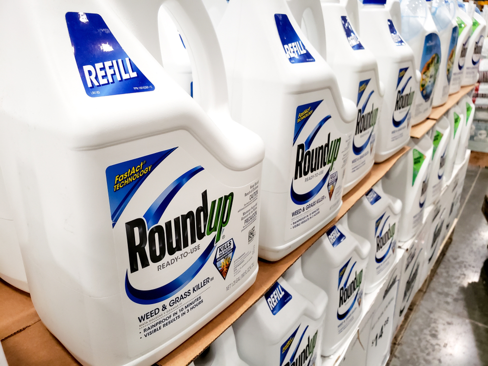 $Several containers of Roundup weed killer at a local home improvement store.