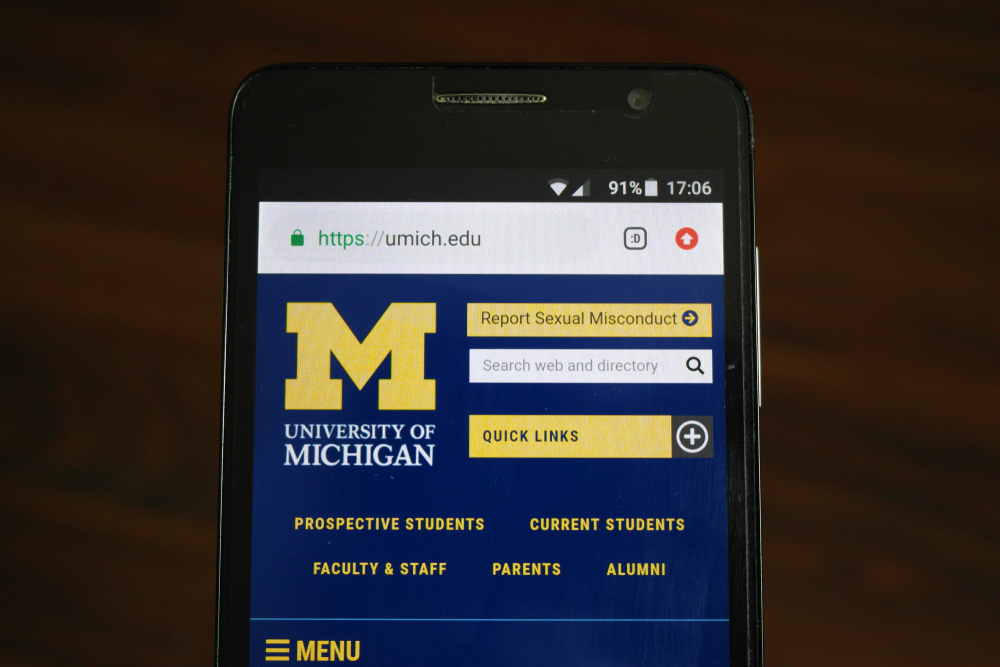 Official website of the University of Michigan displayed on a smartphone.