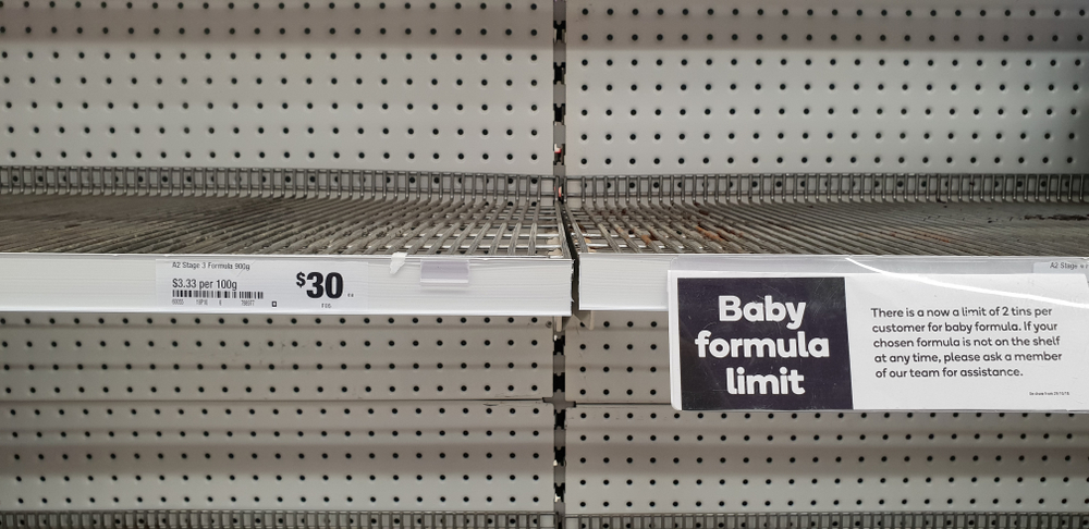 Empty baby formula shelves at a supermarket