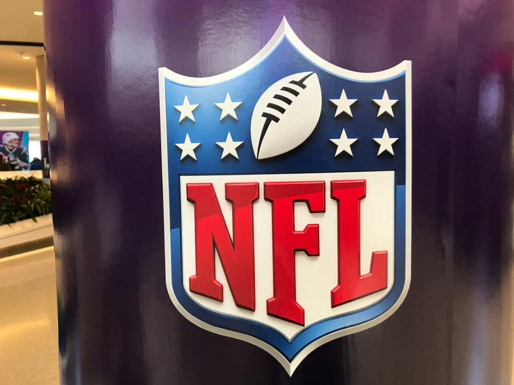 A purple pillar in the mall with the Shield of the NFL