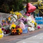 A memorial at Green Bay Road and Central Avenue in Highland Park grows for the seven people who were killed when a gunman opened fire at a parade.