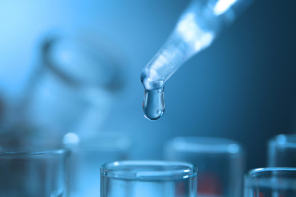Closeup of water being tested in a lab for contaminants