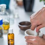 Homeopath preparing alternative herbal medicines.