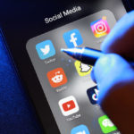 User using Twitter mobile application on an Android smartphone screen.
