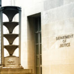 front of the U.S. Department of Justice building in Washington, DC