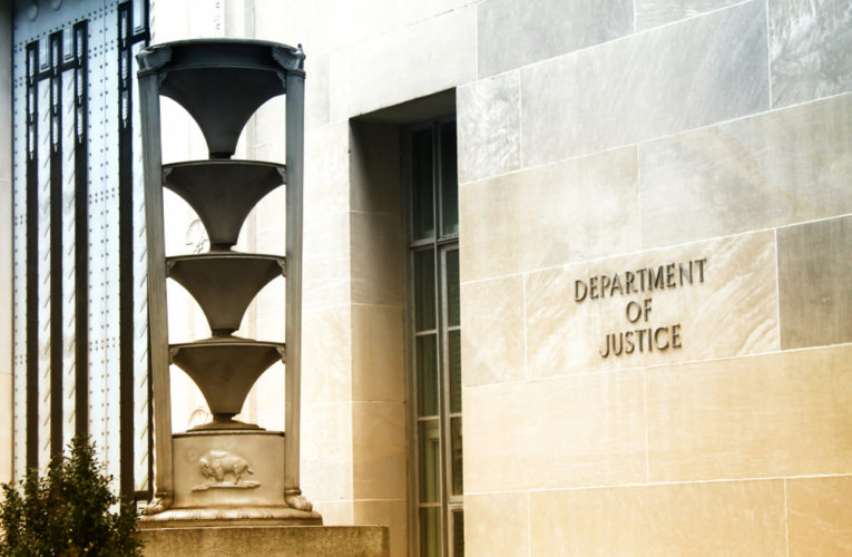 front of the U.S. Department of Justice building in Washington, DC
