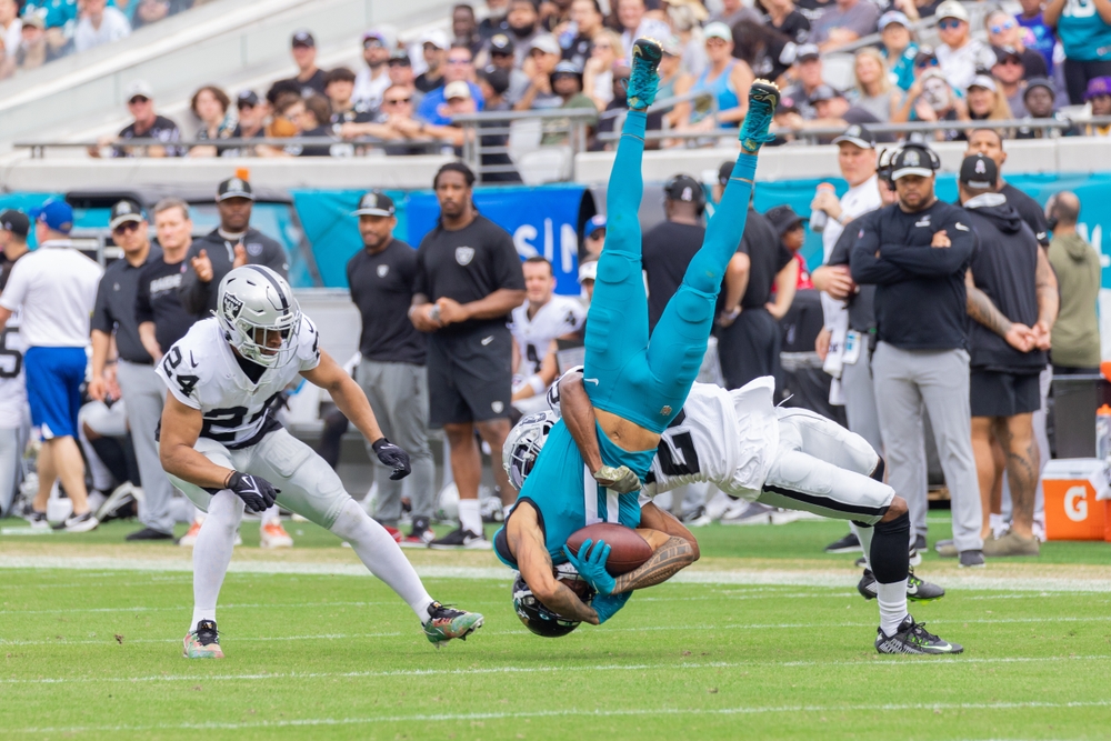 raiders player tackles jaguars player at TIAA Bank Field, jacksonville stadium