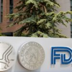 The U.S. Department of Health and Human Services (HHS), U.S. Public Health Service (USPHS) and FDA logos are seen at the FDA headquarters