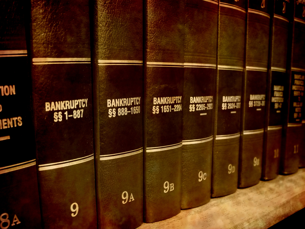 Close up of several volumes of law books of codes and statutes on bankruptcy