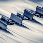 closeup of paper clipped stacks of documents