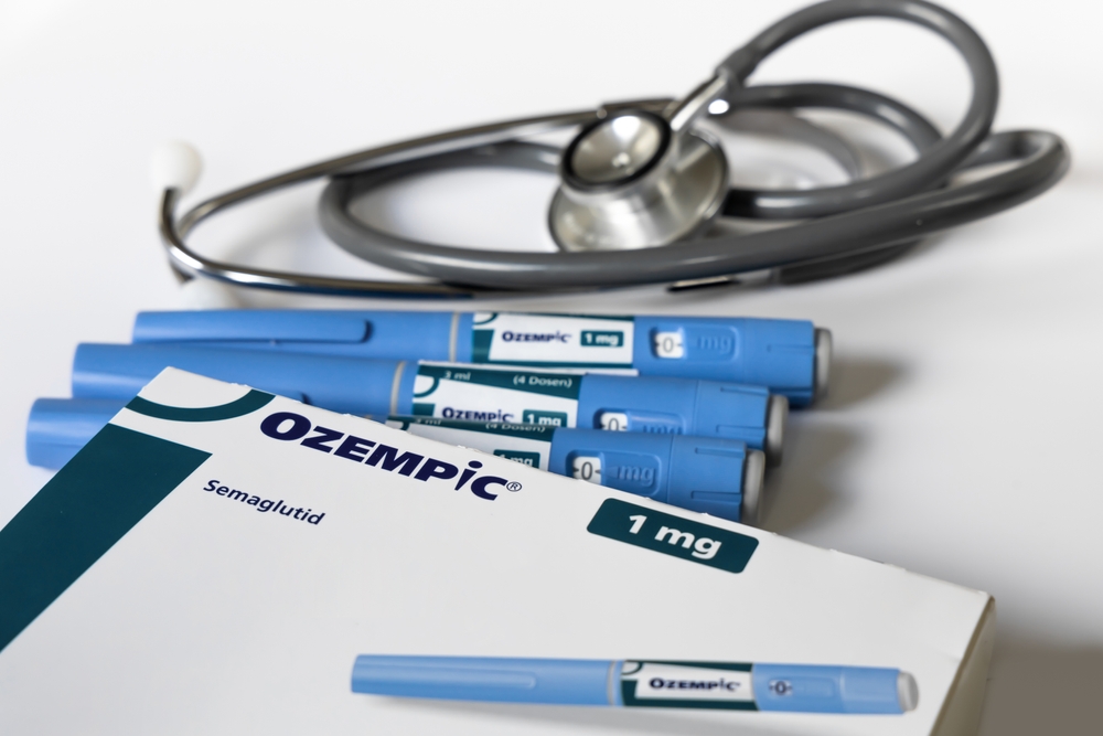 ozempic injectors next to box on table with a stethoscope