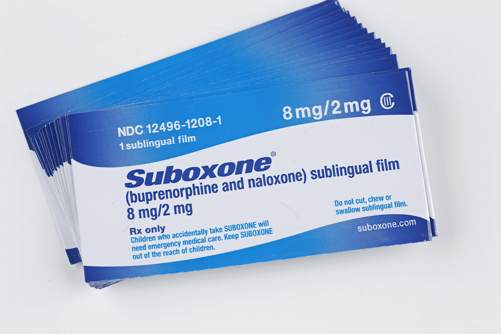 closeup view of Suboxone buprenorphine and naloxone sublingual film on white background