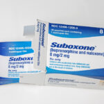 an open box of 8mg suboxone sublingual film with white background