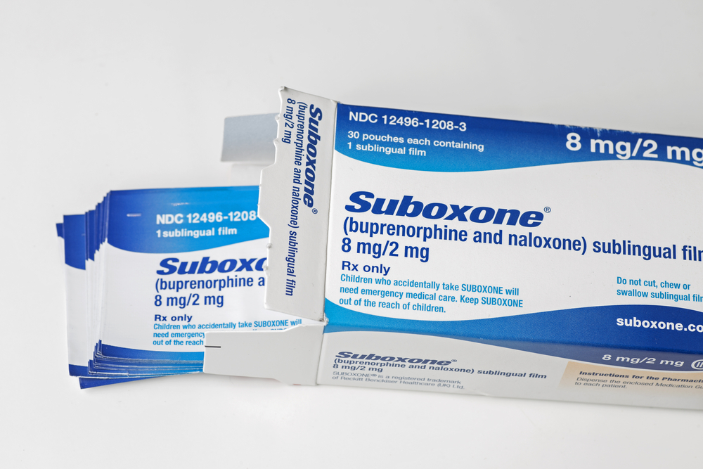 an open box of 8mg suboxone sublingual film with white background