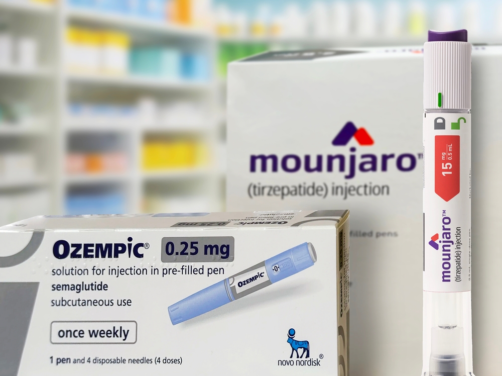 boxes of Ozempic from Novo Nordisk and Mounjaro from Eli Lilly with injection pen with pharmacy shelves in background