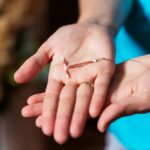 nurse displaying a paragard IUD contraceptive device in her open hands